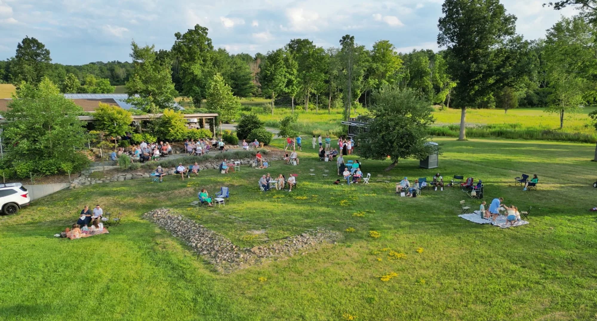 Guests gathered on the lawn for a summer sunset concert